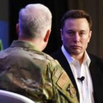 Elon Musk speaks with the U.S. Air Force Lt. Gen John Thompson