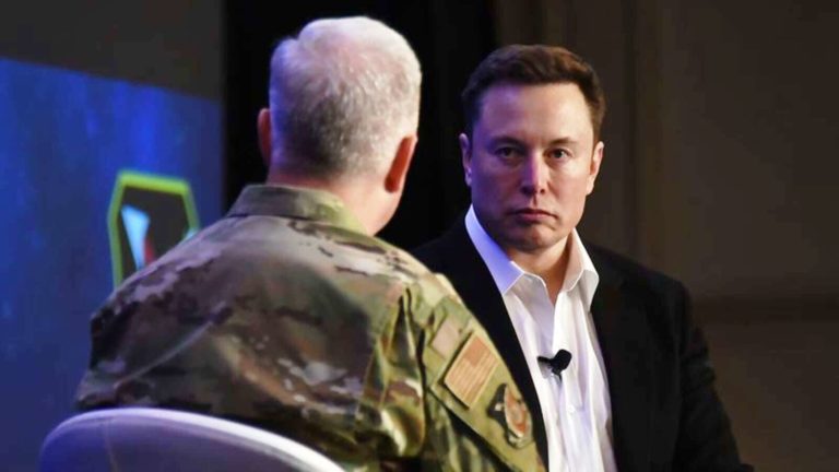 Elon Musk speaks with the U.S. Air Force Lt. Gen John Thompson