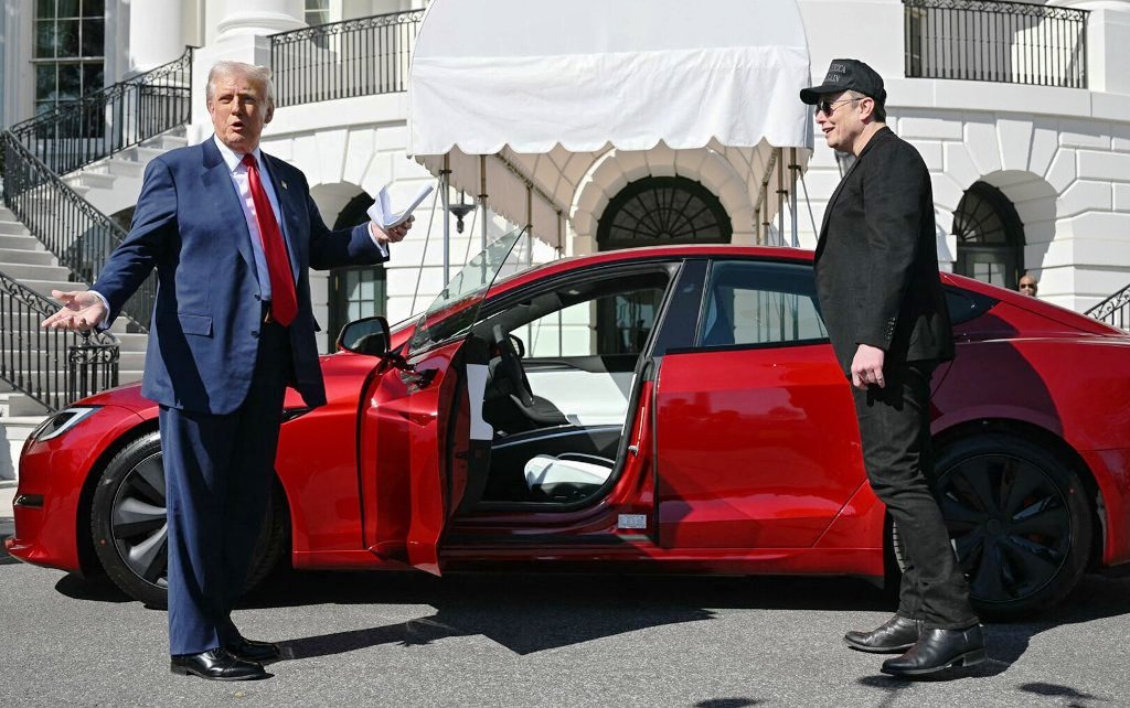 Trump, along with Musk, shows new Tesla cars on the white house lawn.